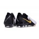 Chaussure Nike Phantom Luna 2 Elite L FG Blanc Noir Pièce Dor Métallique